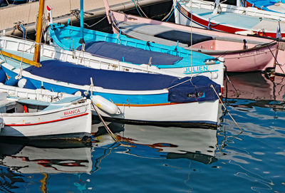 Fishing boats moored at harbor