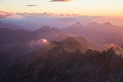 Scenic view of mountains against sky during sunset