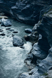 High angle view of rocks in sea