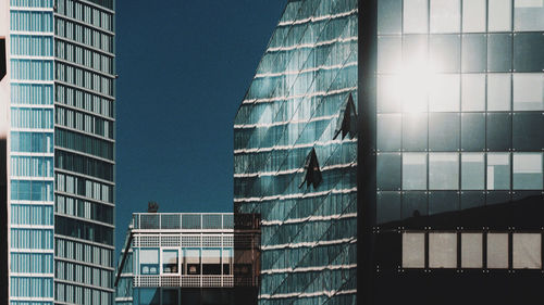 Low angle view of modern building against clear sky