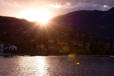 River with town against sunset