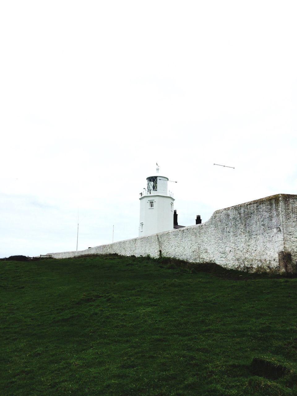 field, building exterior, architecture, built structure, nature, day, outdoors, lighthouse, no people, grass, landscape, beauty in nature, sky, scenics, agriculture, mammal