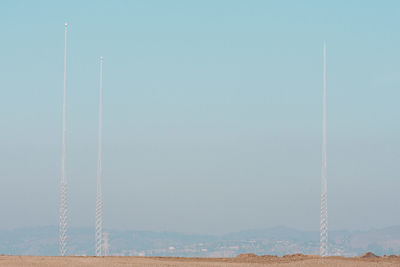 Low angle view of vapor trail against clear blue sky