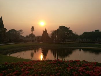 Scenic view of lake against sky during sunset