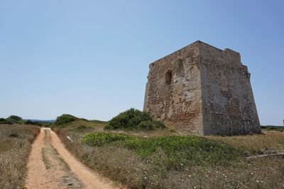 Stone wall against clear sky