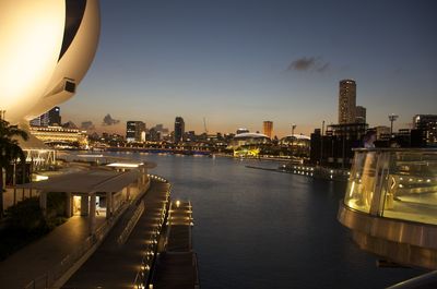 Illuminated city at waterfront