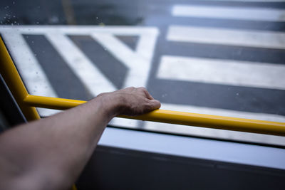 Close-up of human hand on train