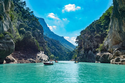 Panoramic view of sea and mountains against sky