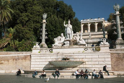 Statue in front of historical building