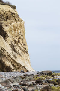 Low angle view of rock formation against clear sky