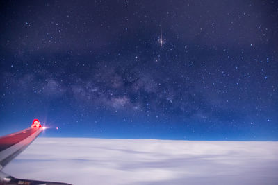 Airplane against sky at night