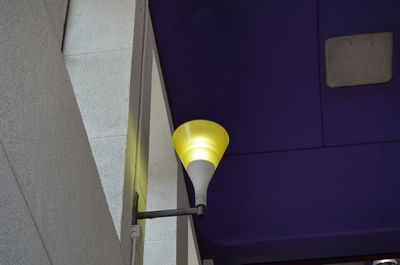 High angle view of electric lamp against wall