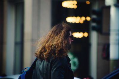 Rear view of woman against blurred background