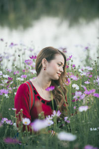 Woman looking at flowering plants