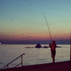 Scenic view of sea at sunset