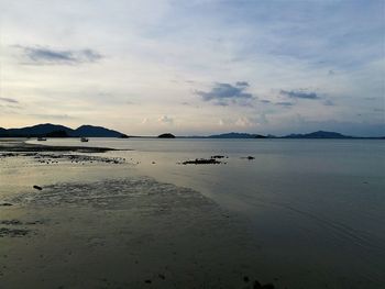 Scenic view of sea against sky at sunset