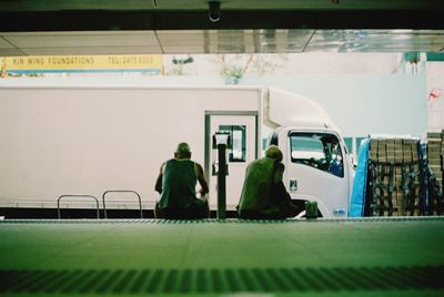 Woman standing against wall