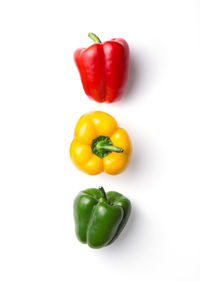 Close-up of bell peppers against white background