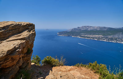 Scenic view of sea against clear blue sky