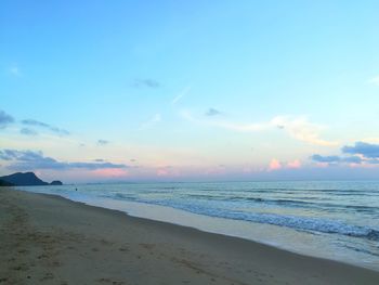 Scenic view of beach against sky during sunset