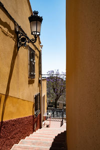 Street amidst buildings against sky