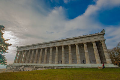 Low angle view of historical building against cloudy sky