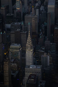 Aerial view of buildings in city at night