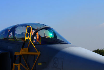 View of airplane against clear blue sky