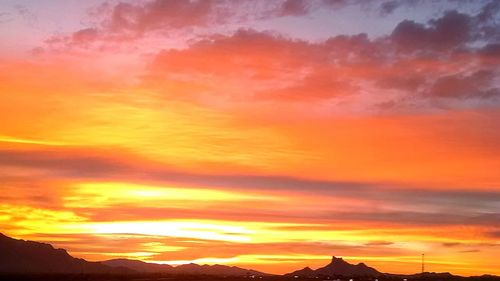 Scenic view of mountains against dramatic sky