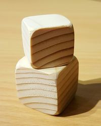 Close-up of wooden cube shape on table