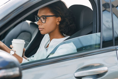 Portrait of woman in car