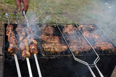 High angle view of meat on barbecue grill