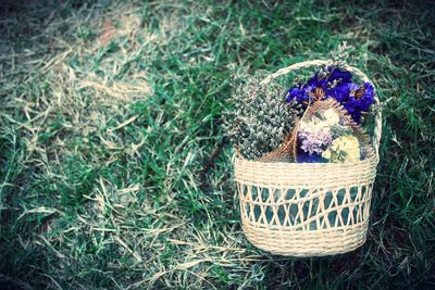 High angle view of wicker basket on field