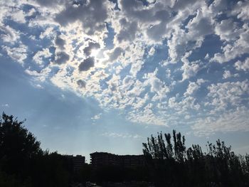 Low angle view of building against cloudy sky