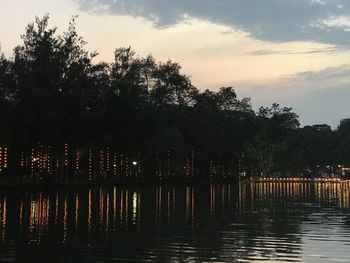 Scenic view of lake against sky at sunset