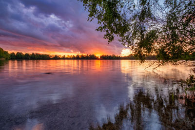 Scenic view of lake against sky during sunset