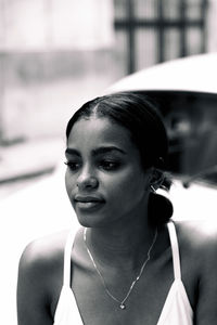 Portrait of young woman looking away