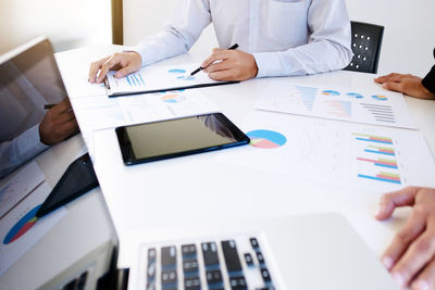 High angle view of man using laptop on table