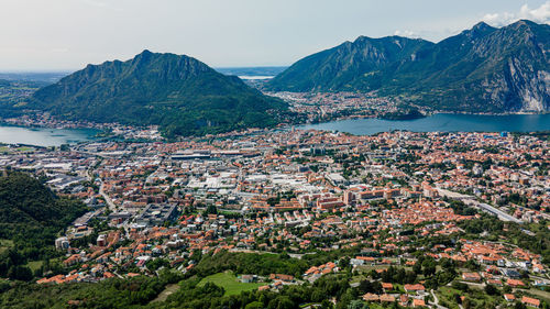 High angle view of townscape and mountains against sky