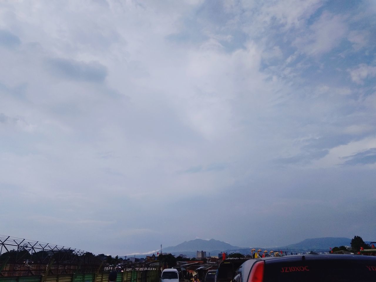 cloud - sky, sky, architecture, nature, building exterior, built structure, city, mode of transportation, transportation, outdoors, day, no people, tree, building, beauty in nature, landscape, plant, low angle view, house