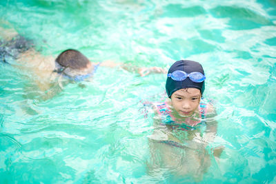 Boy swimming in pool