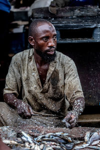 Man looking away at fish market