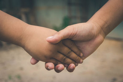 Close-up of hand holding hands