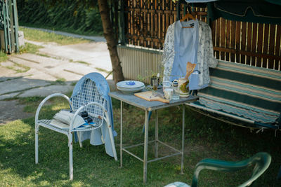 Man sitting on bench in yard