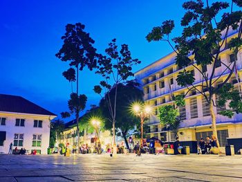 Buildings against sky at night