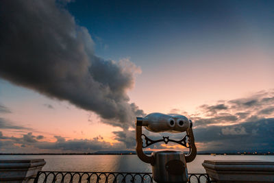 Panoramic sea binoculars with spectacular sunset in the background