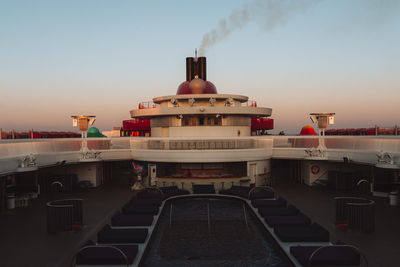 Illuminated cruise ship at sunset