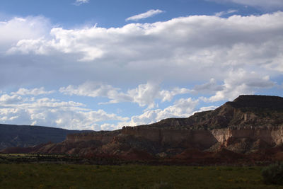 View of rocky landscape against cloudy sky