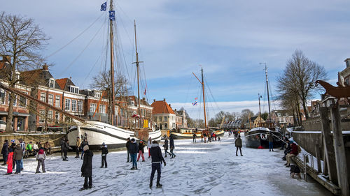 Winter fun in the city dokkum on the canals in the netherlands person