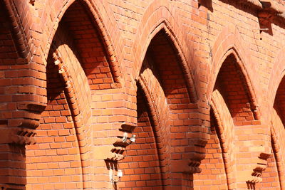 Low angle view of brick wall of building